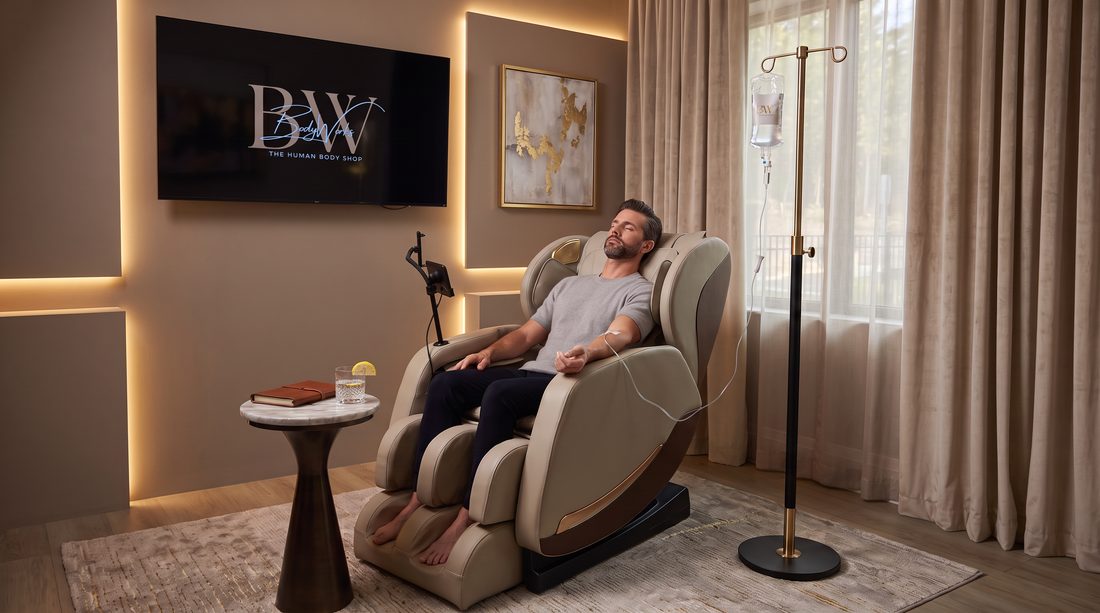 A patient receiving an infusion in a reclining chair in the L(IV)E Lounge at BodyWorks